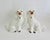 This pair of English matched left-and right-facing pair of seated Staffordshire ceramic Spaniel figurines feature a glossy...