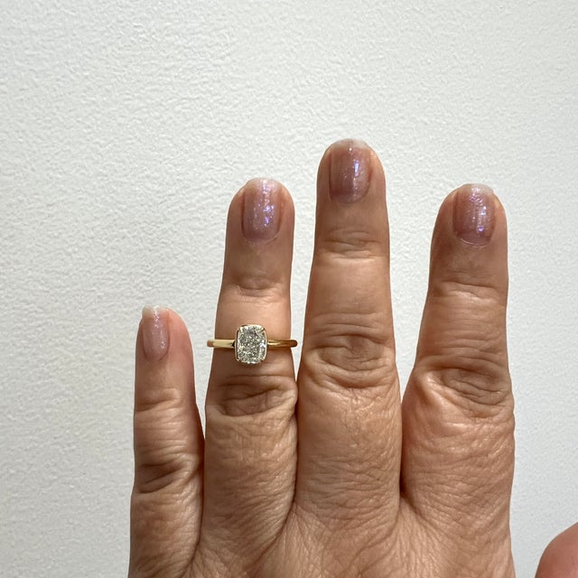 Beautiful 1.50 ct. J SI1 white diamond cushion. Handmade in 18k yellow gold bezel. Ring size 6.5. Includes a GIA certificate.