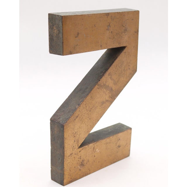 Vintage block style letter Z made of brass with a brushed finish. The piece has a hollow back. Good condition with surface...