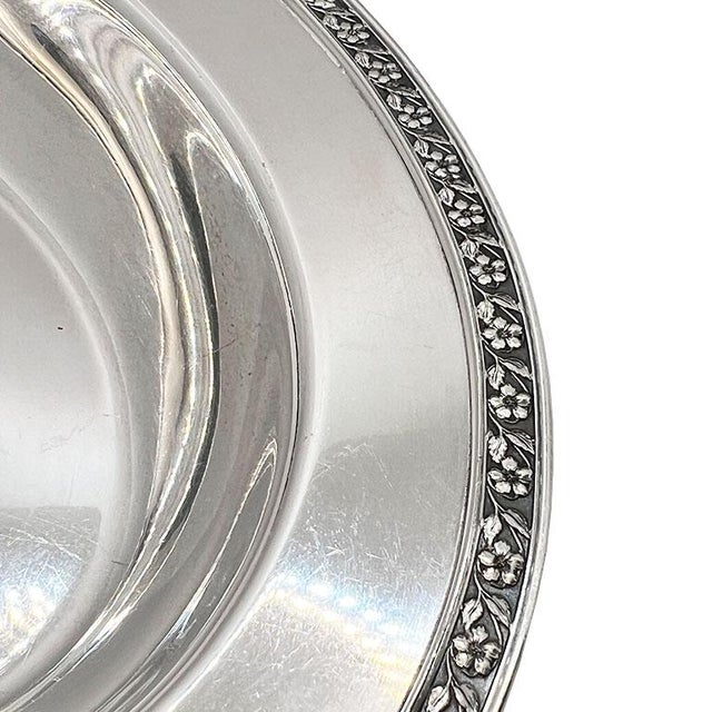 A silver-plated oval vegetable serving bowl by the Forbes Silver Company. This piece is in the Carolina Rose pattern and...