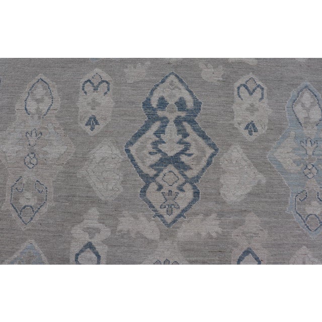 Turkish Oushak Rug With Soft Gray Field and Pale Blue Geometric Motifs For Sale - Image 10 of 16