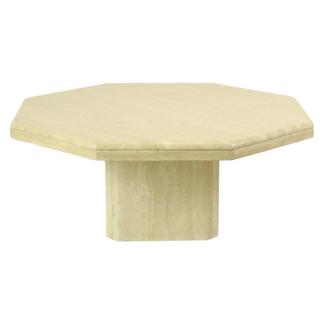 Vintage octagonal designer coffee table made of Italian travertine; a high-quality design piece from the 1970s. The...