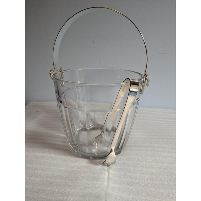 Elevate your bar cart with this striking mid-century modern vintage ice bucket set. Crafted from heavy, clear pressed...