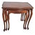 Cherry wood polished to a soft glow, each table slides gracefully beneath the other, a nest of four bound by...