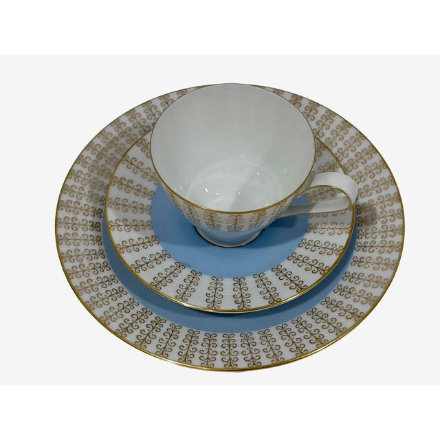 This 3-piece set by Rosenthal Germany includes a tea cup, saucer, and small plate, all featuring a wide pale blue band...