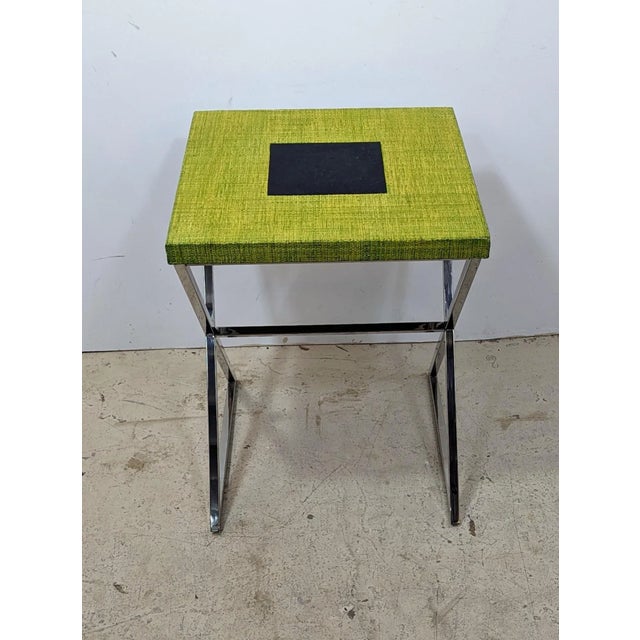 High quality modern side table constructed solid chrome base and green fiber top with tessellated stone inlay. New Old Stock.