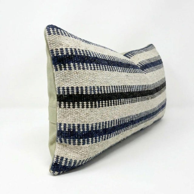 This beautiful 10'' x 20'' hand-woven Kilim pillow cover was made from an authentic Turkish kilim. The traditional flat-...