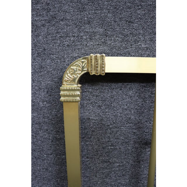 Rectangular frame with vertical spindles and cast corner brackets. Central oval medallion with raised classical scene....