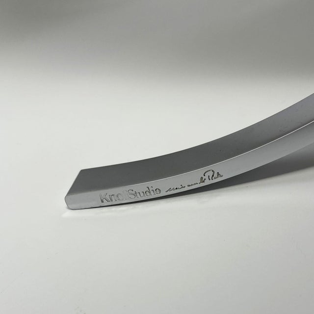 This set consists of an original knoll barcelona chair and matching ottoman, a recent edition and finished in ivory...