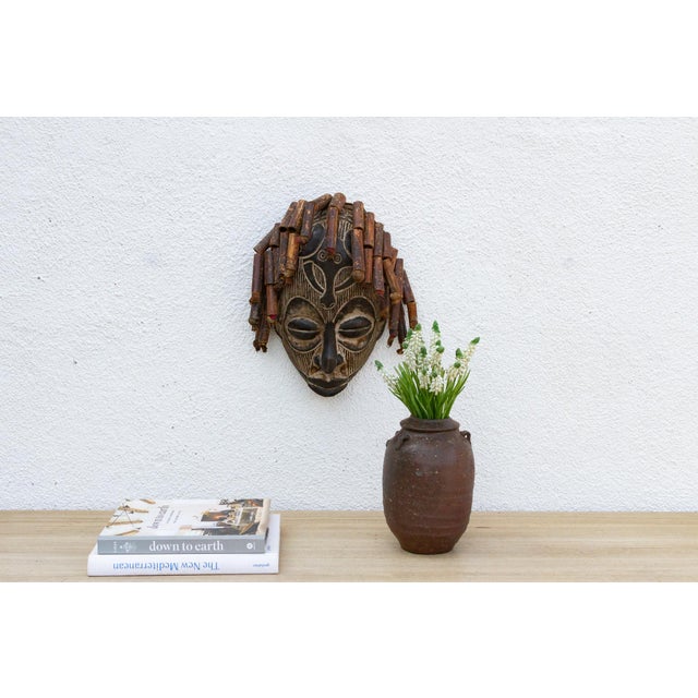 This serene Guro mask from the Ivory Coast is a beautiful example of African tribal art. The mask is characterized by its...