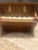 Bring a touch of whimsical musical history into your home with this antique Schoenhut miniature piano-style music box....
