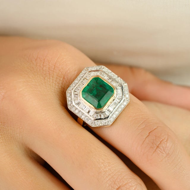 Make a bold statement with this exquisite 14K yellow gold emerald and diamond cocktail ring. Featuring a vibrant cushion-...