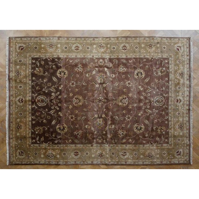 A large hand-knotted Indian rug from the Agra region, dating from around 1990. The rug is made of high-quality wool on a...