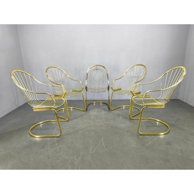 Set of five dining chairs designed by Gastone Rinaldi and produced by Rima, Italy, in the 1970s. These chairs feature a...