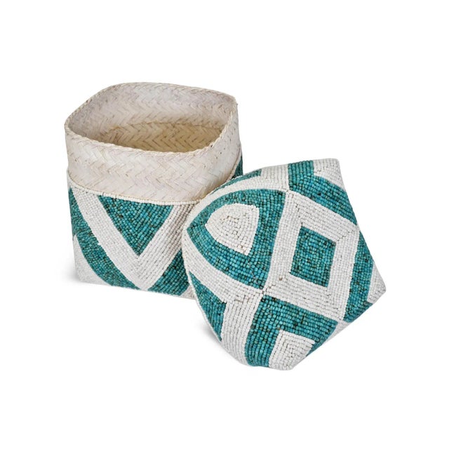 Beautiful hand beaded accessory box made from woven bamboo and intricately covered with geometric triangle patterns. Very...