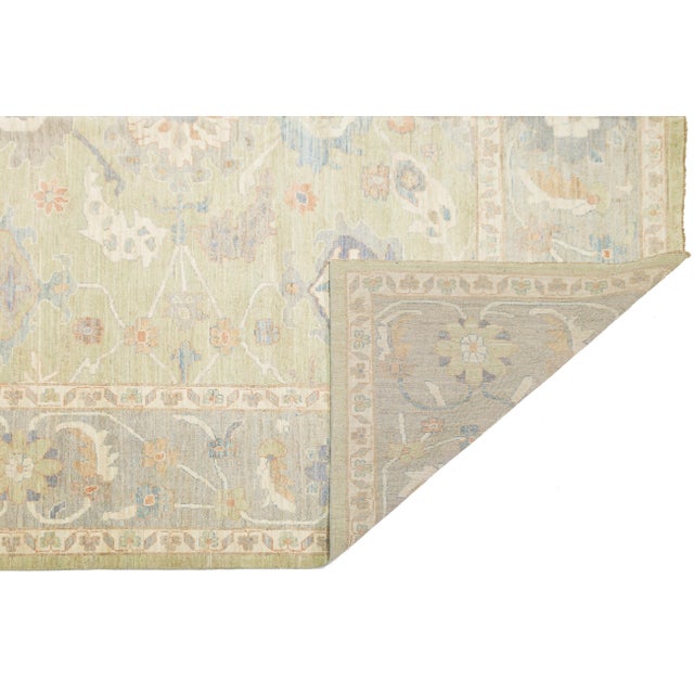 This Modern Oushak Style rug adds a fresh touch to any interior with its soft, muted colors and timeless design. Hand-...