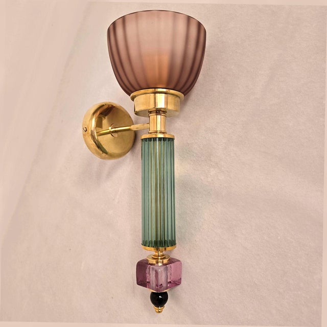Pair of mid-century modern Murano glass wall sconces, Italy circa 1990s. The pair of Italian sconces is made of Green with...