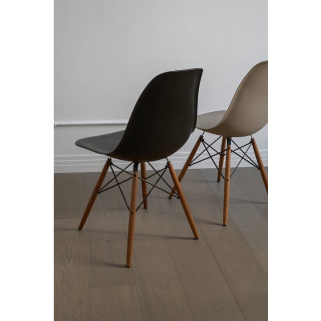 Pair of Eames Dowel-Leg Molded Shell Side Chairs for Herman Miller, 2014. A handsome pair of Eames molded shell side...
