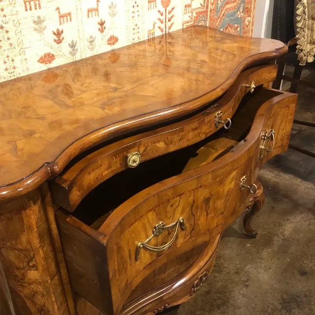 Three drawer Italian walnut shaped chest/console, featuring walnut oyster wood style inlays with rosewood line inlay edge...