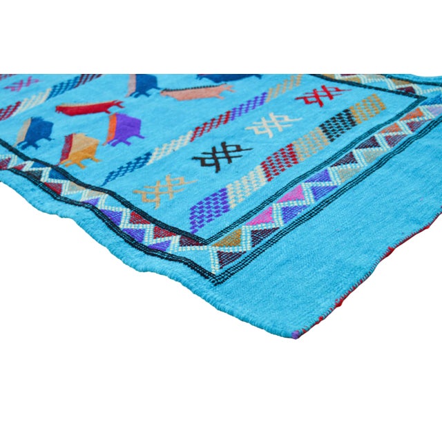 Handwoven Moroccan flat-weave wool and silk rug, featuring an elegant rhythmic pattern of colorful birds, intricate Berber...