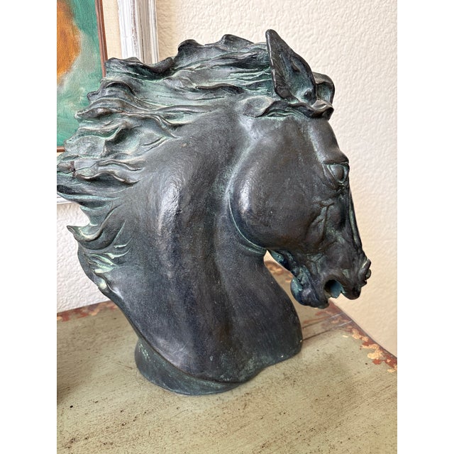 Vintage 1970s large sculptural horse head. Rustic and elegant with a soft green patina on the main and Rich details...