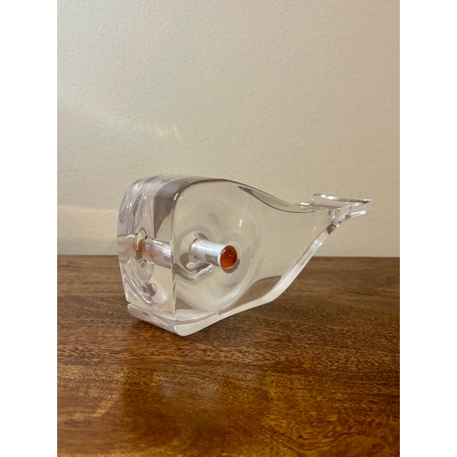 A refined mid-century modern lucite sculpture depicting a stylized whale in profile. Executed with clean, cubist-inspired...
