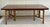Here is an absolutely stunning dining table attributed to McGuire. The base features a bundled bamboo design, where you...