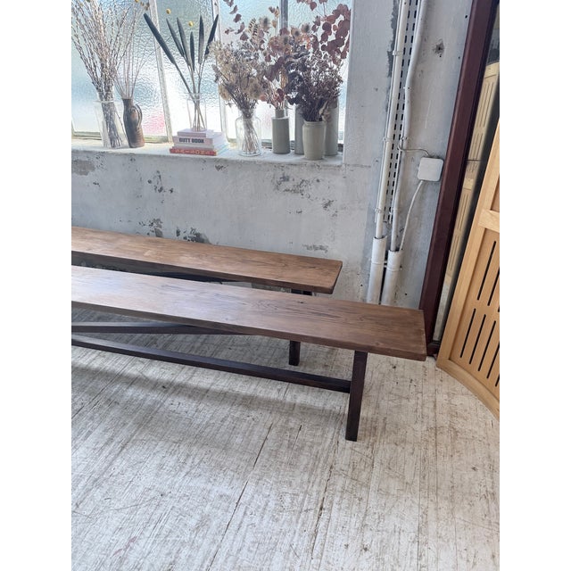 Antique pair of solid oak benches, 4 meters long! We love the simplicity of their lines; the legs and crossbeams provide...