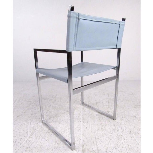 This stylish vintage chrome dining set includes six matching Stendig style chairs with matching chrome frame dining table....