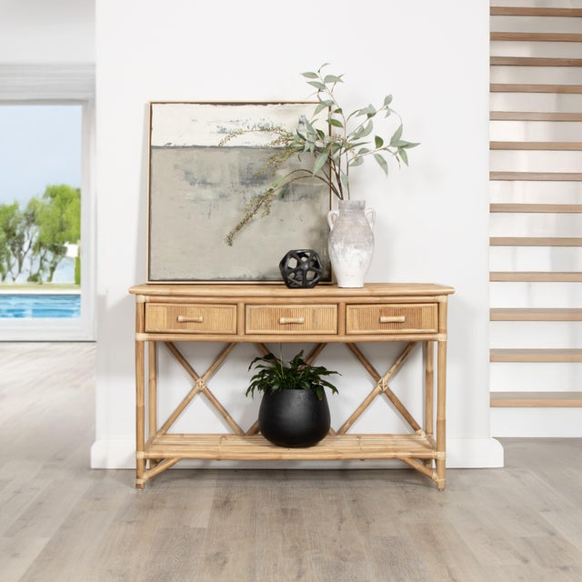 Versatile and highly functional, this classically designed sideboard features a Pencil Rattan top, sides and drawer...