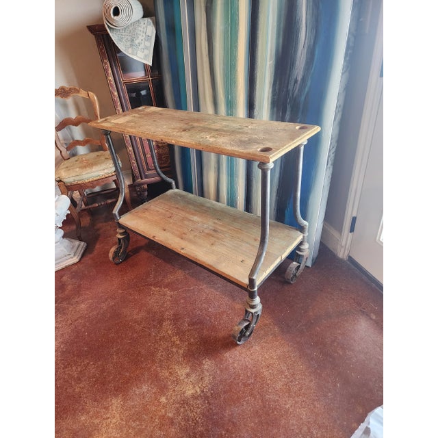 Charming antique rustic wood and cast iron two tier cart...Great as a kitchen island or work table. It would be great with...