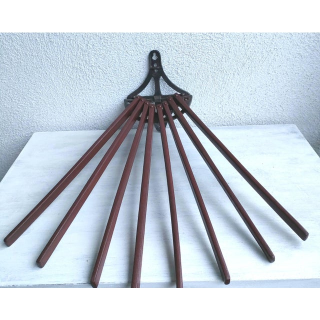 Rare fan-shaped towel rack in wood and wrought iron, dating from early bathrooms. The wrought iron base supports eight...