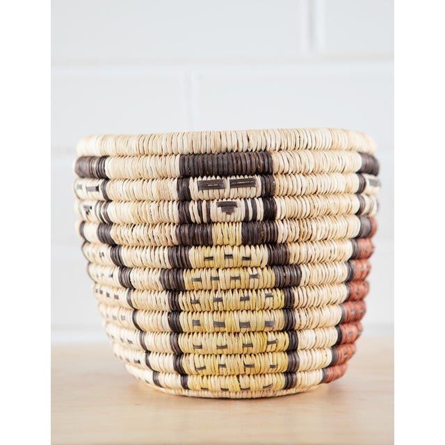 The figures are Kachina figures attributed to the HOPI Culture of the Second Mesa. Hopi baskets are made from rabbit...