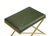 The Garrett Leather Stool has a polished brass "X" base and a green leather seat. The seat has a crisscross pattern...