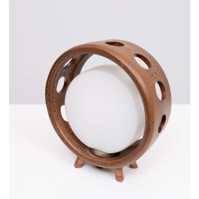 Very nice Table lamp . Round Brown Ceramic base ,comes with its original Opaline Glass Shade , Super rare . Small socket...