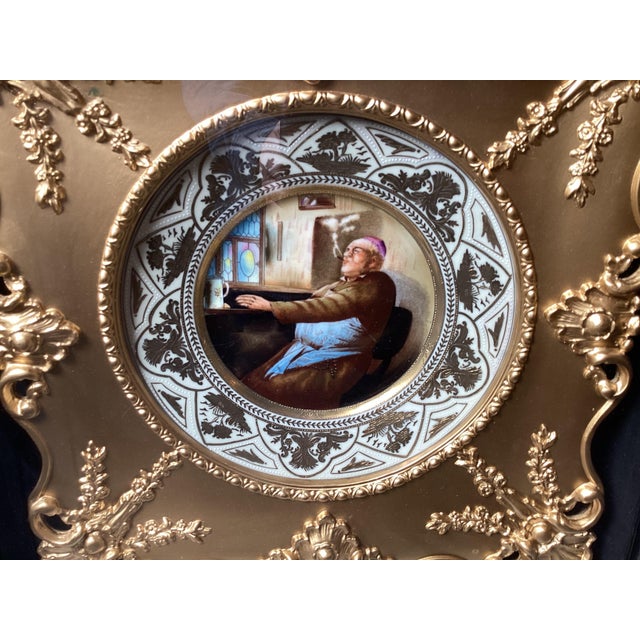 A hand painted porcelain cabinet plate with elaborate hand decorated raised gilt border, the central figure of a bishop....