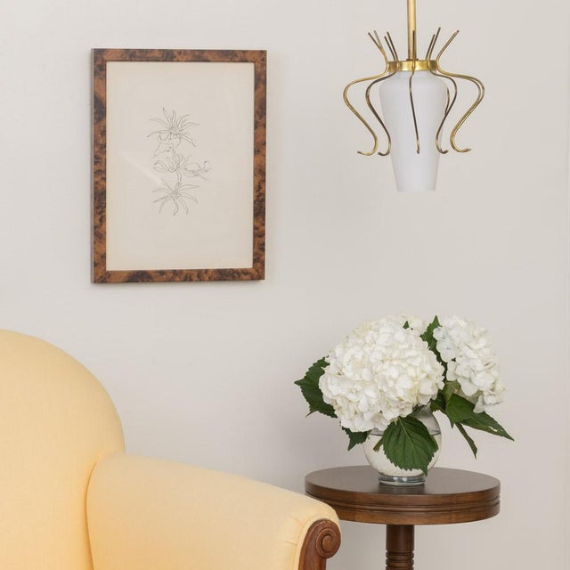 Lovely brass and white glass pendant light from Italy, 1950s. Thin brass curved open frame and white glass shade. Original...