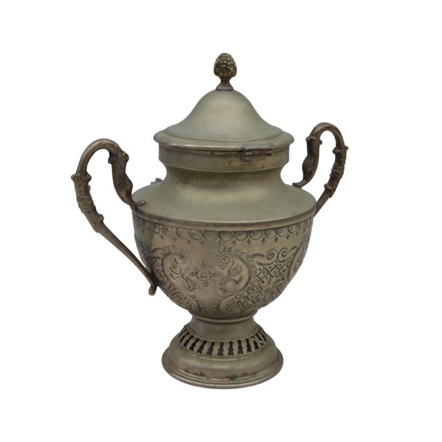 Antique Moroccan hand-hammered urn constructed of solid silver. Exhibiting an intricate Arabesque design and ornate hand-...