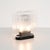 Lari mini by angelo mangiarotti, 2023 lari mini is a portable version of angelo mangiarotti’s original lari lamp from...