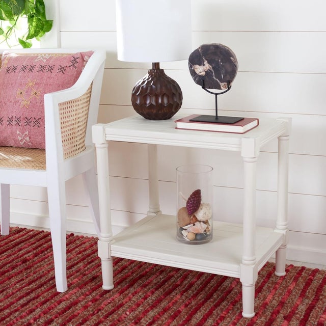 This Rafiki Rectangle Accent Table brings a touch of classic charm to any interior with its fresh new take on British...