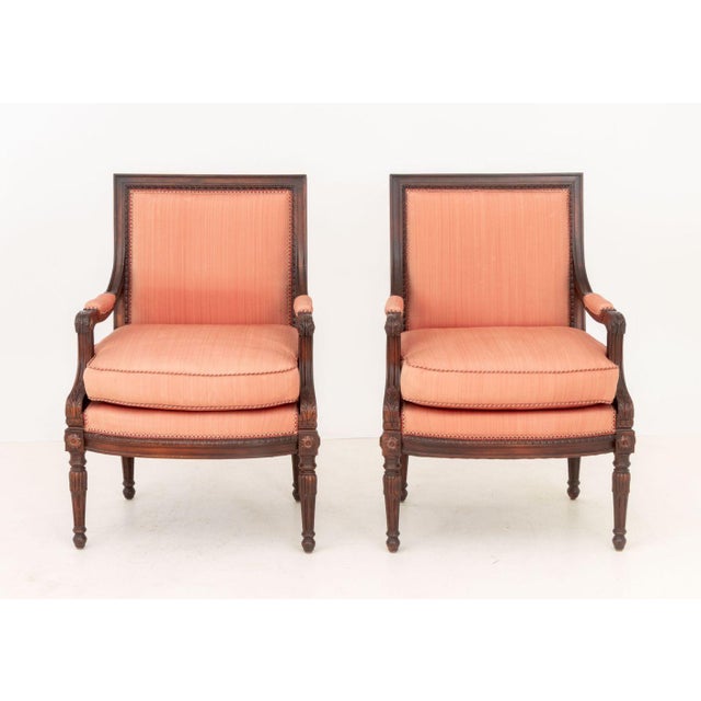 Pair of Louis XVI Style Stained Mahogany Arm Chairs, each with red upholstered seat and back on fluted tapered legs. 38.5"...