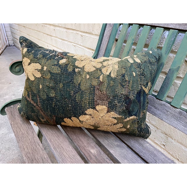This decorative pillow is upholstered with an exceptional 18th-century verdure tapestry, beautifully woven with silk...