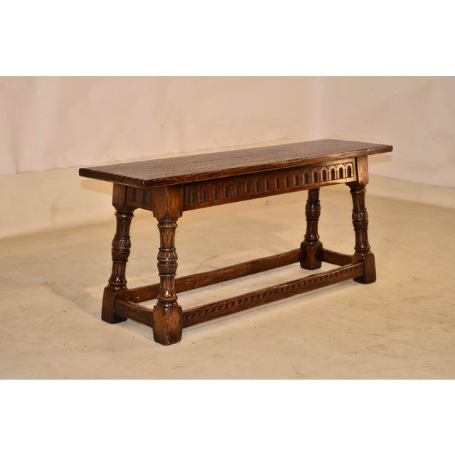 Edwardian oak joint bench from England, circa 1900. the bench has a gorgeous top, with pie crust ends, following down to a...