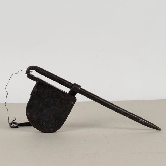 This antique padlock, believed to date back to the 19th century, is a remarkable example of period hardware. Its elongated...