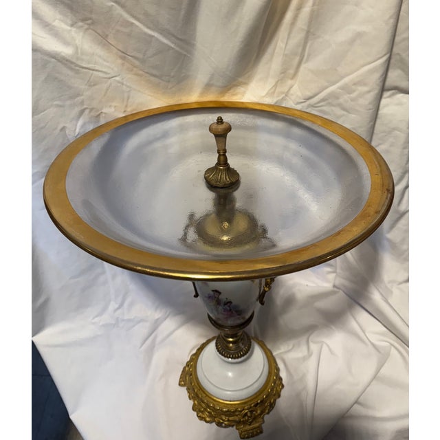 An antique French Sevres-style porcelain and gilt bronze (ormolu) urn or vase with a glass serving tray. 16" H
