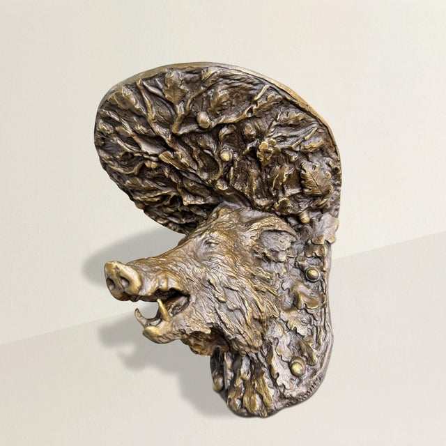 Bold and full of character, this cast bronze wall bracket takes the form of a wild boar’s head, its mouth agape to reveal...