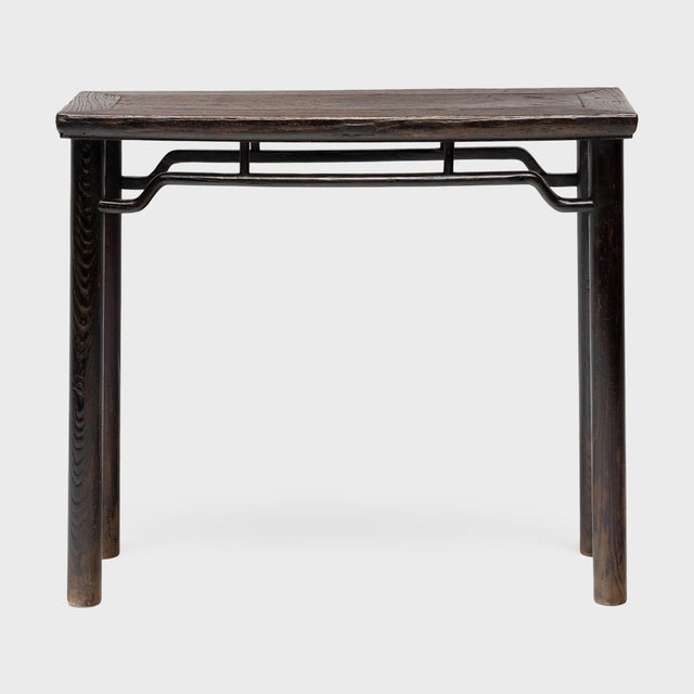 This narrow Chinese console table feels open and light, the perfect addition to an entryway or hallway alcove. Crafted of...