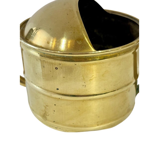 Charming petite antique French brass watering can. Perfect for watering small plants . Holds water. Sourced in France.