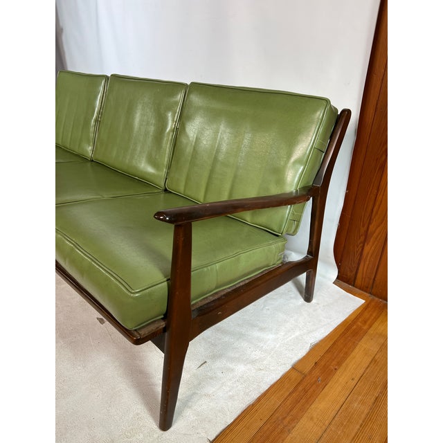 For sale is this very nice vintage sofa that is made out of walnut.