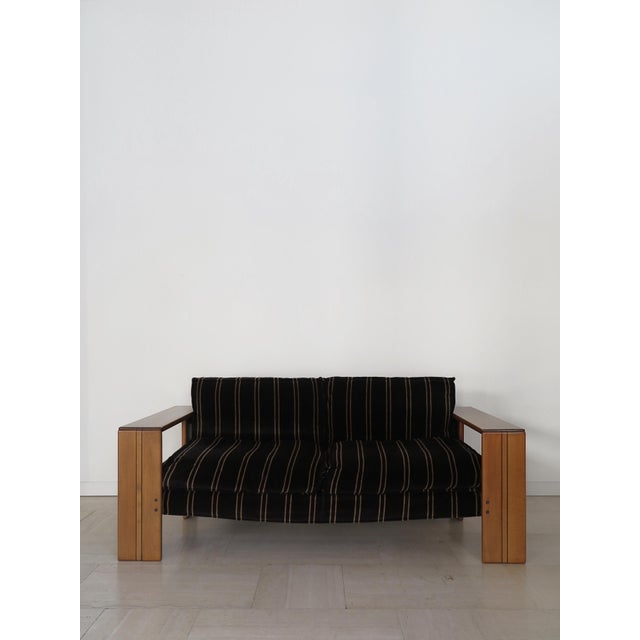 Italian two-seater sofa from the “Artona” series designed by Afra & Tobia Scarpa for Maxalto in the 70s with a solid wood...